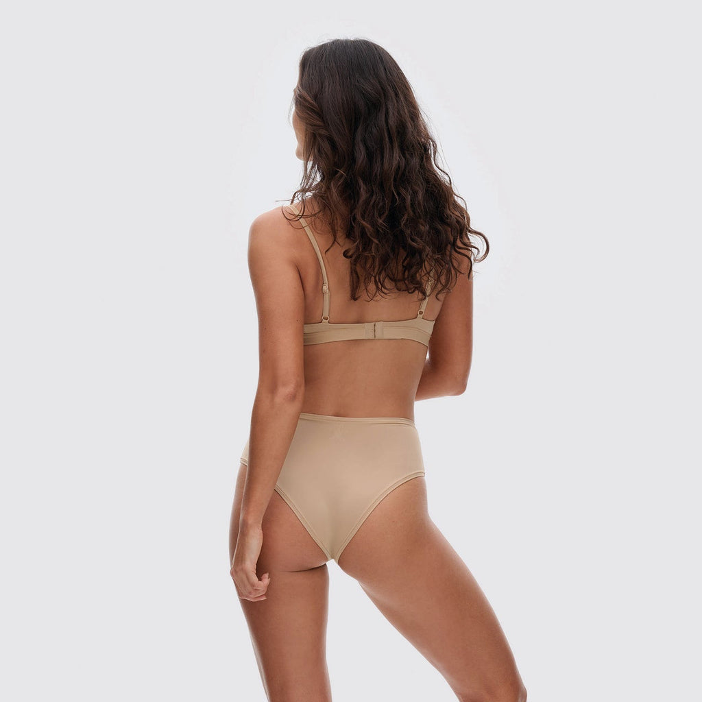 Nude triangle bralette on model, back view