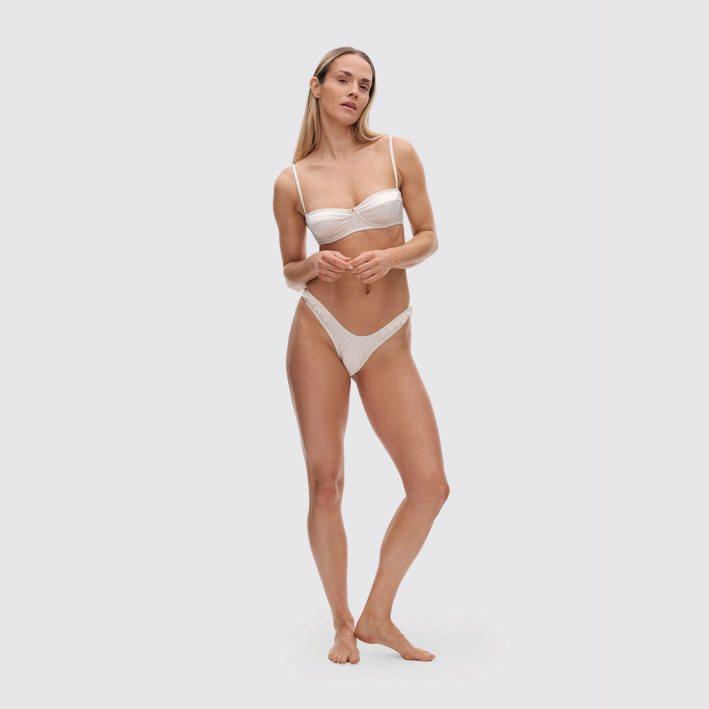 Ivory V-shaped satin thong on model, full body view